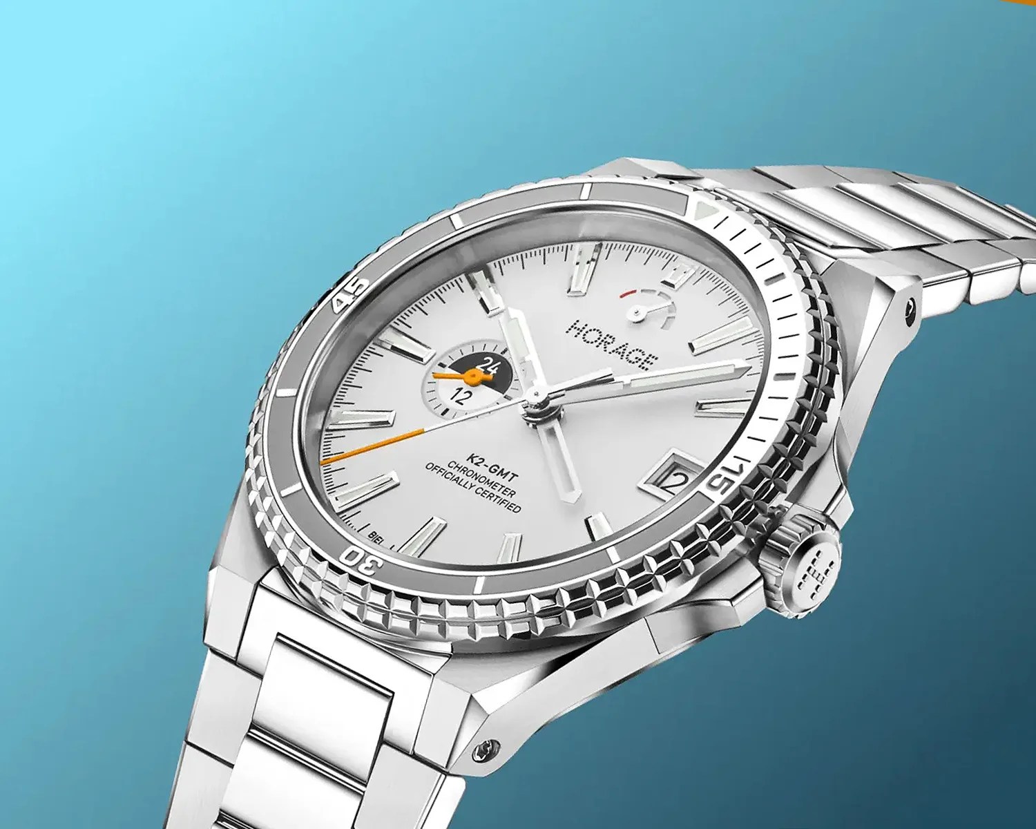 Silver stainless steel Horage K2-GMT chronometer watch with white dial and orange second hand on a blue background.