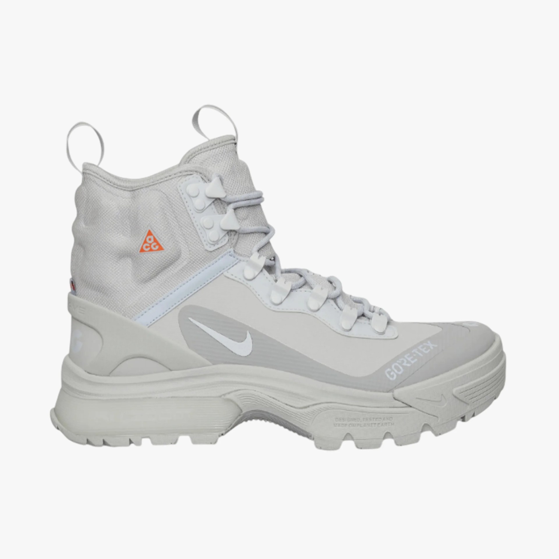 Light gray high-top Nike ACG Gore-Tex hiking boot with white swoosh and rugged sole.