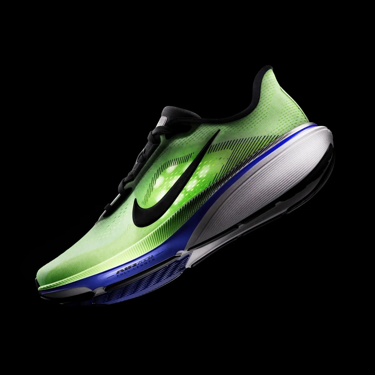 Neon green Nike running shoe with black swoosh and blue and white sole on black background.