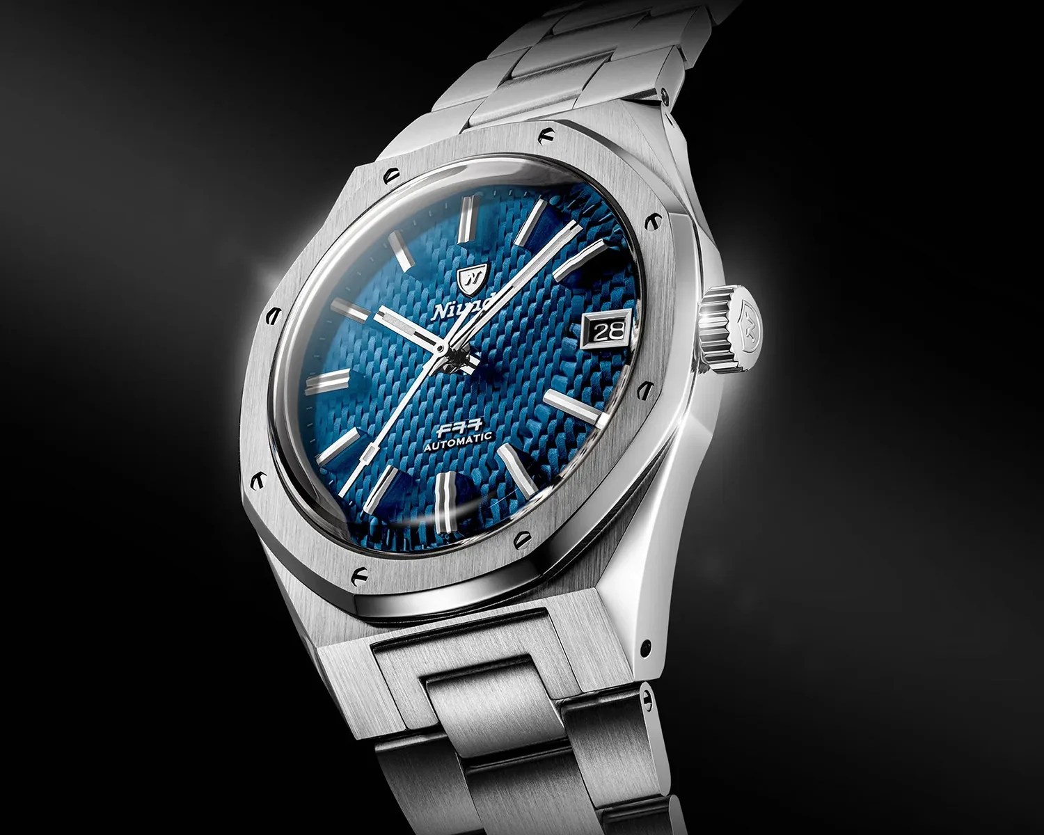 Stainless steel wristwatch with a textured blue dial, silver hour markers, and a date window at 3 o'clock.