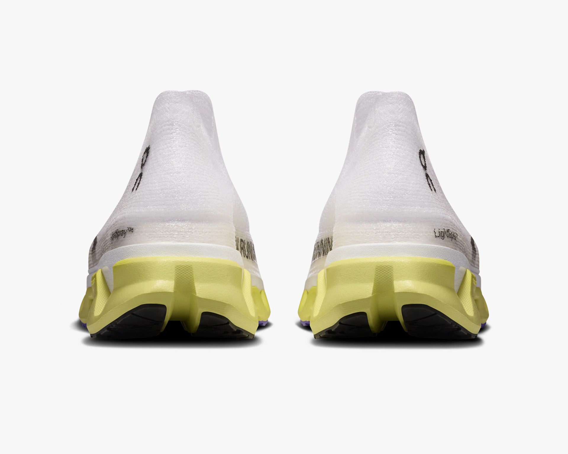 Pair of white running shoes with yellow soles shown from the back on a white background.