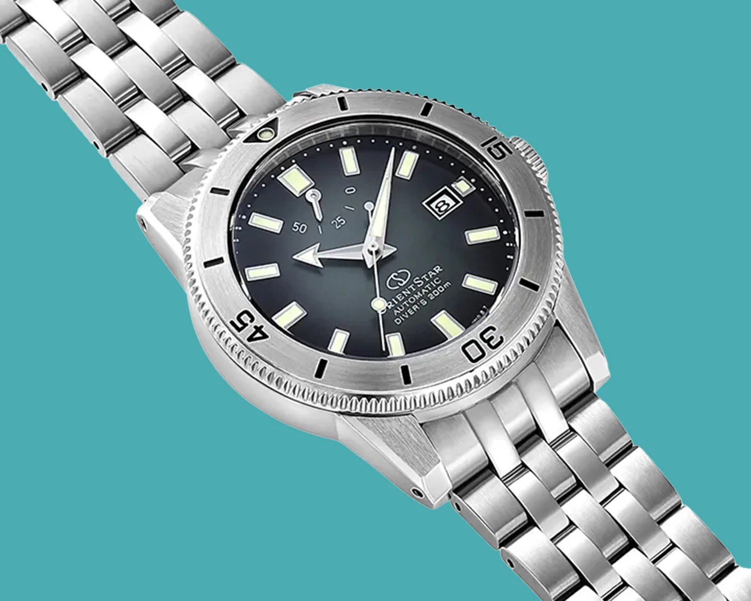 Silver stainless steel dive watch with black dial, luminous markers, date window, and rotating bezel on a metal bracelet.