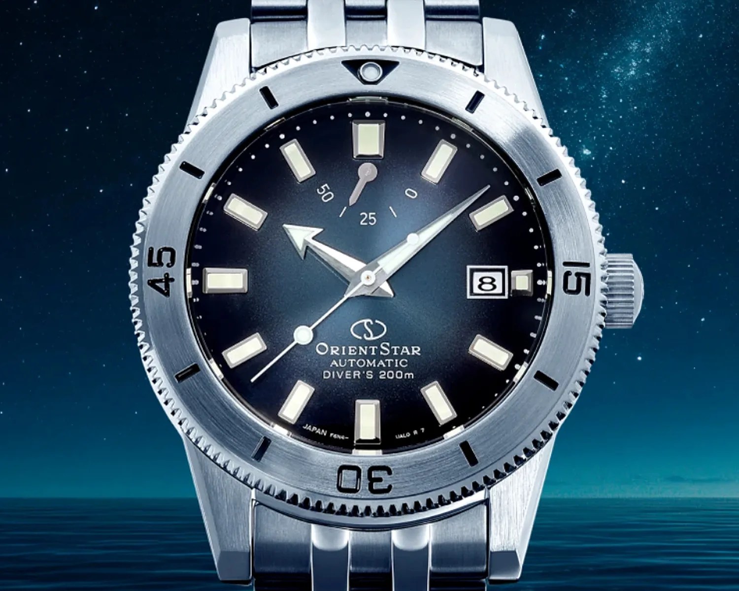 Stainless steel Orient Star automatic diver's watch with black dial, luminous markers, date window, and rotating bezel.