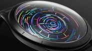Close-up of a black smartwatch with a colorful, circular digital interface under a curved glass screen.