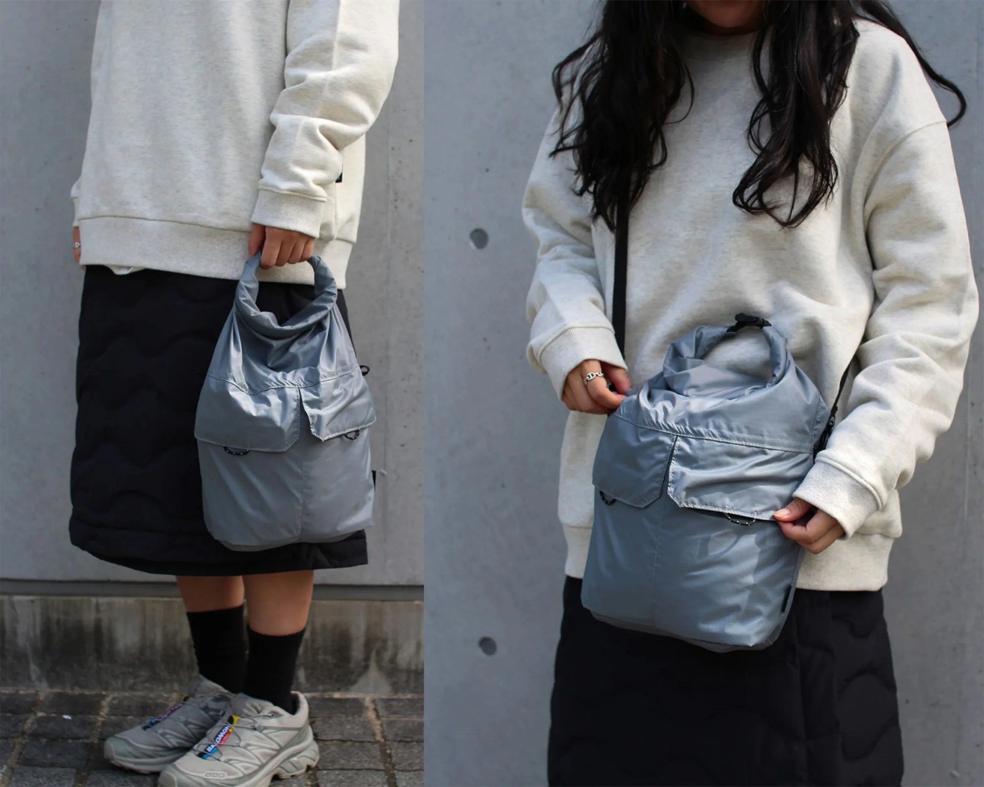 Gray nylon tote bag with front pockets held by a person wearing a beige sweatshirt and black quilted skirt.