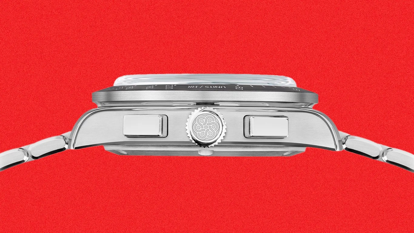 Side view of a silver metal wristwatch case with two rectangular pushers and a crown with an engraved logo against a red background.