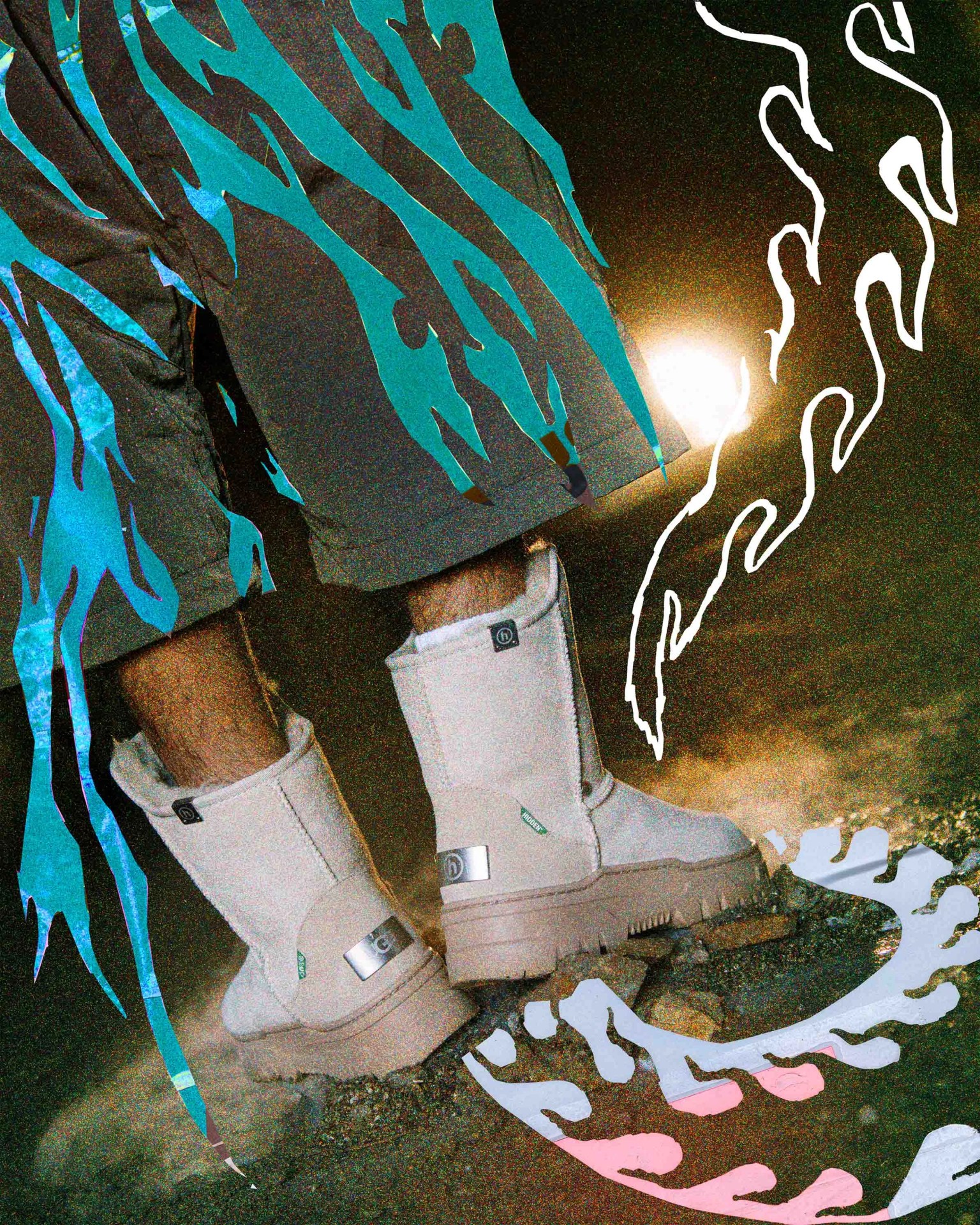 Beige mid-calf boots with thick soles worn with pants featuring blue flame designs, standing on rocky ground with artistic flame overlays.