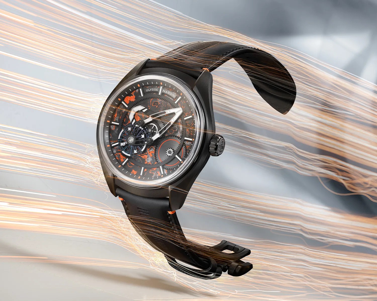 Black Ulysse Nardin wristwatch with orange accents and visible gears, shown with dynamic light streaks.