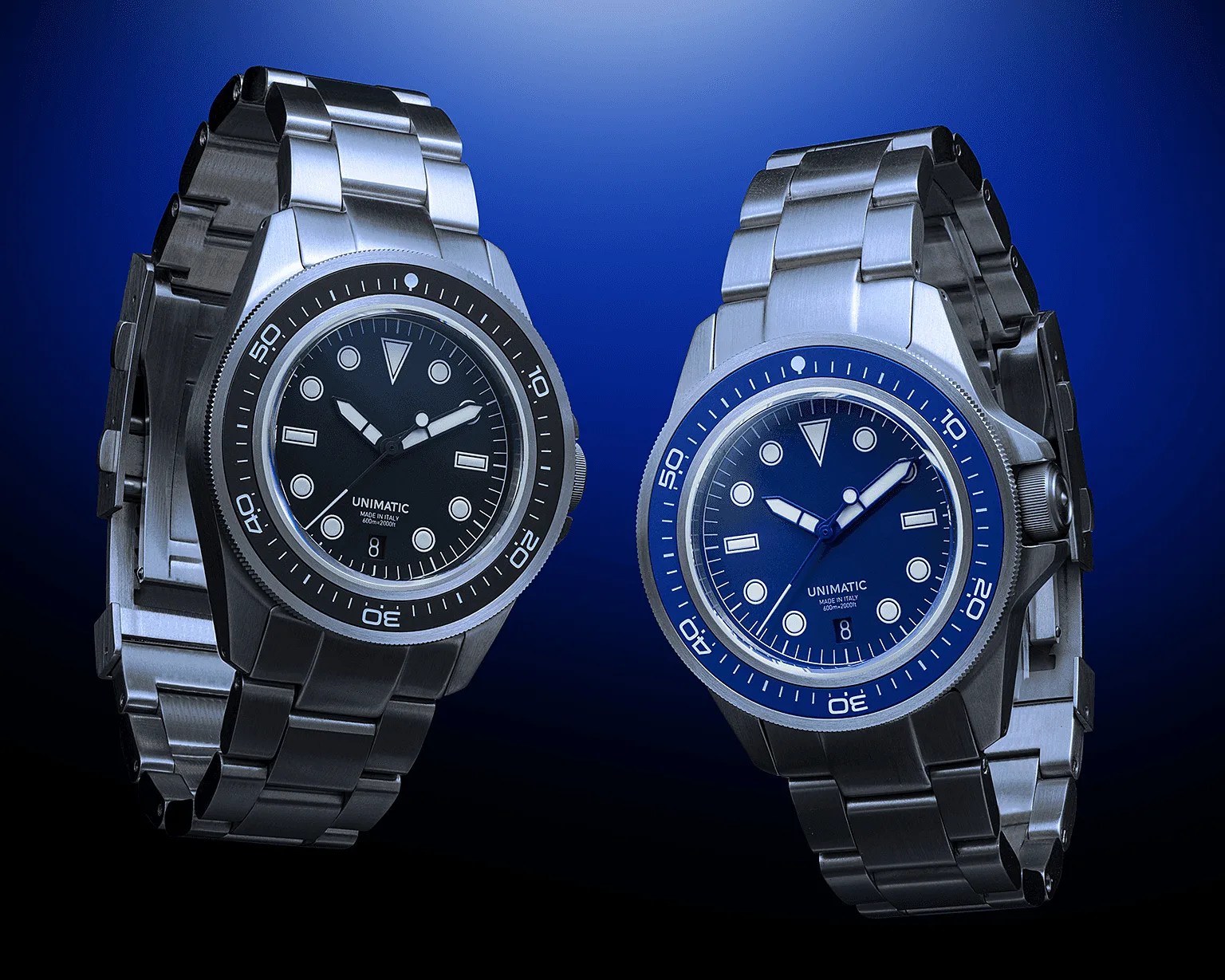 Two stainless steel Unimatic wristwatches with black and blue dials and rotating bezels on a blue gradient background.