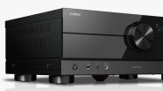 Black Yamaha Aventage audio receiver with volume knob, power button, USB port, and headphone jack.