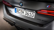 Rear view of a matte gray BMW M5 with AC Schnitzer ACS5 Sport badges and a German license plate.