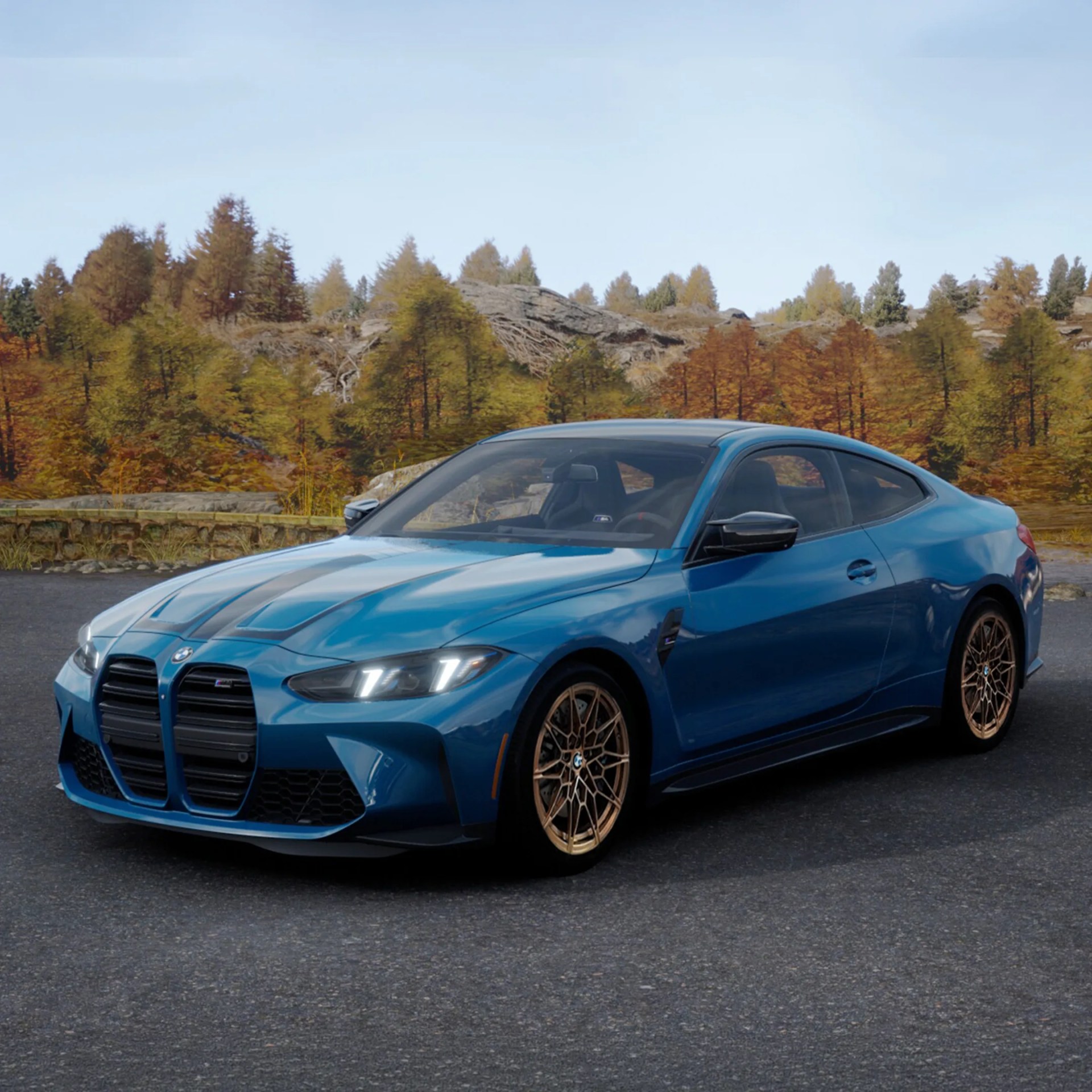 Blue BMW M4 coupe with bronze multi-spoke wheels parked on asphalt with autumn trees in background.