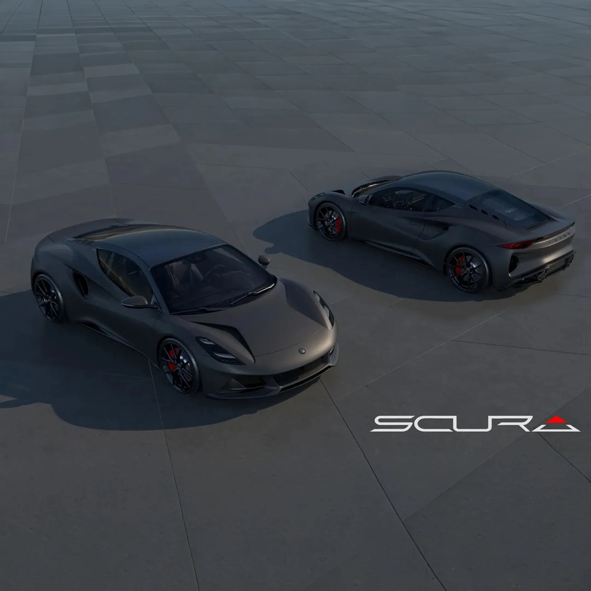 Two matte gray Scura sports cars with red brake calipers parked on a large tiled surface.