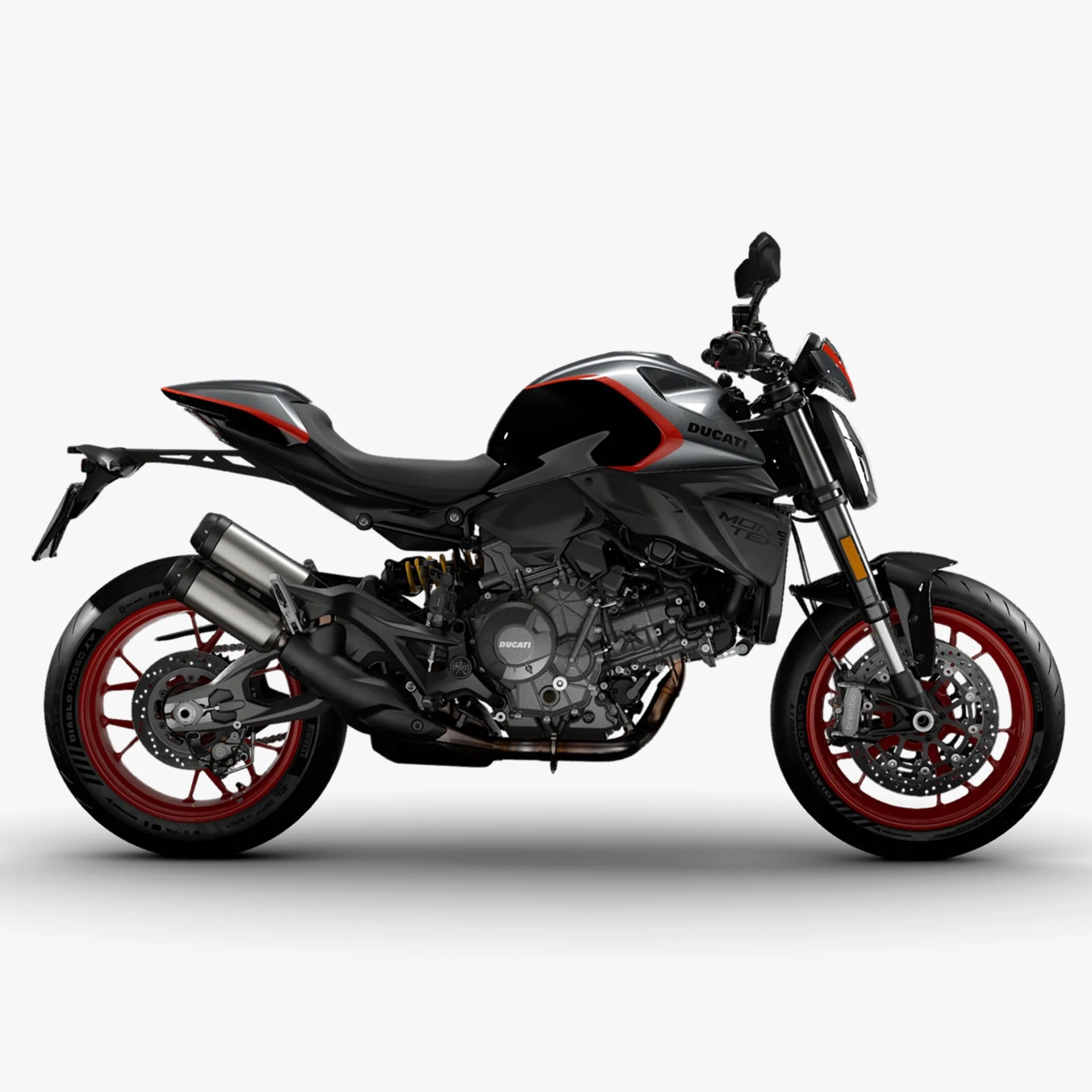 Black and silver Ducati Monster motorcycle with red rims and dual exhaust pipes on a white background.