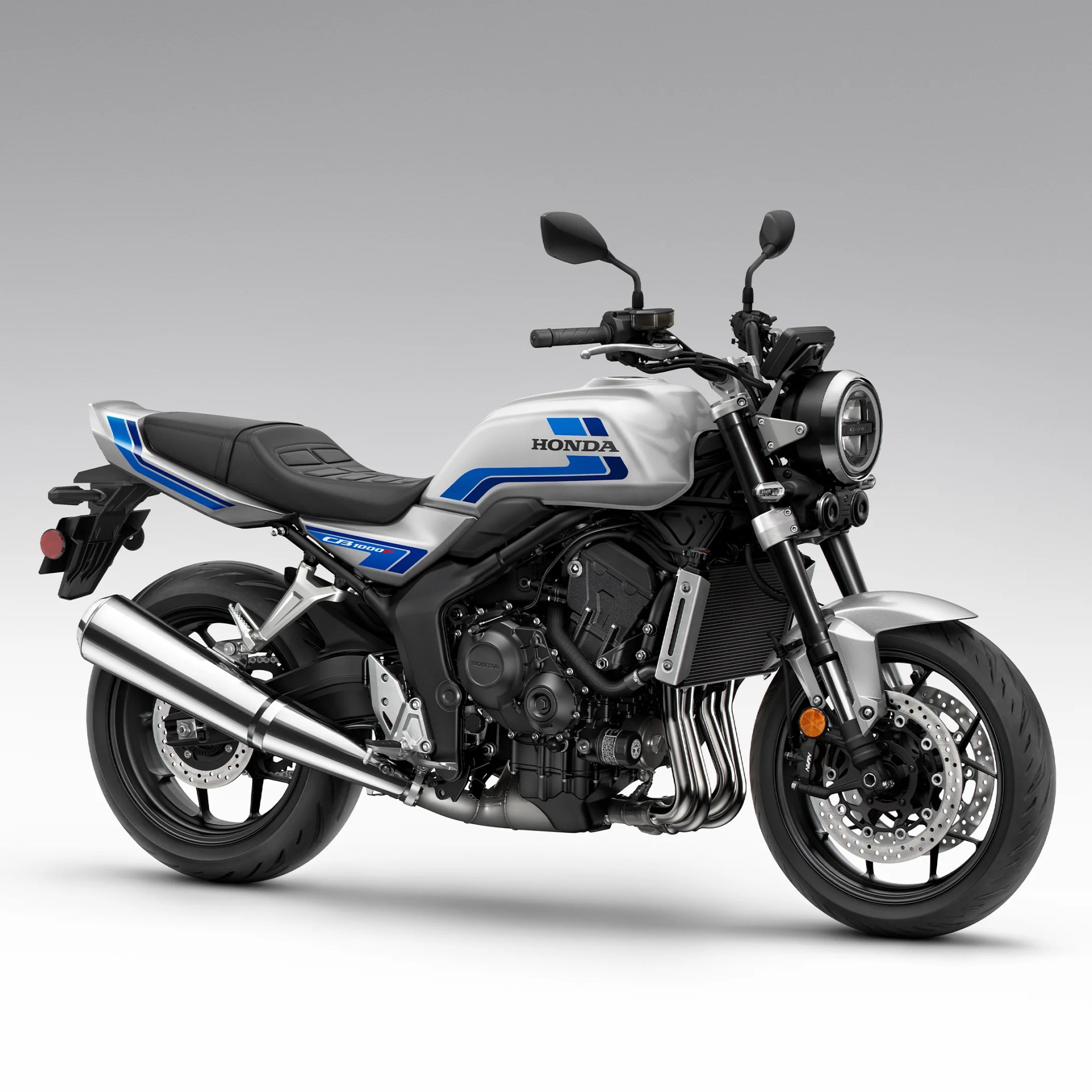 Silver and black Honda CB1000R motorcycle with blue accents and round headlight on a gray background.