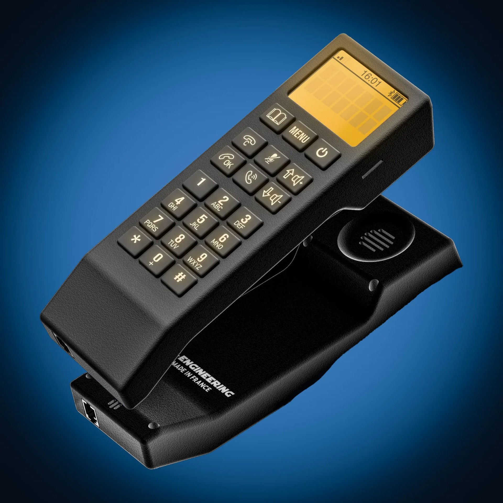black vintage-style car phone with numeric keypad and yellow backlit screen on a matching base.