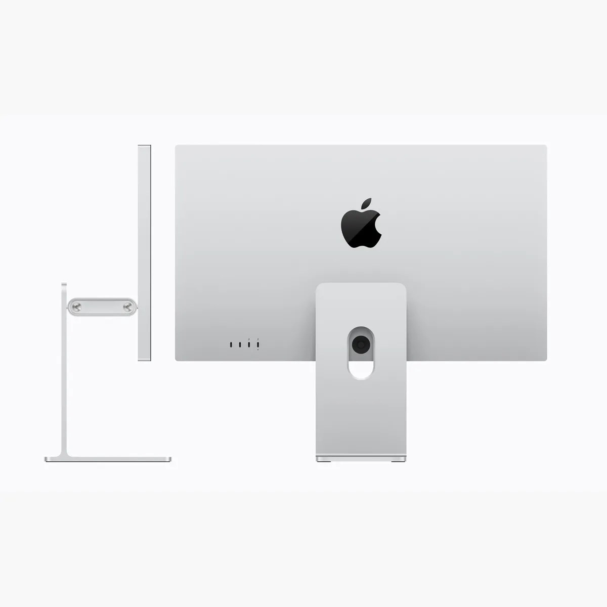 Silver Apple iMac computer shown from side and back views with black Apple logo on the back.