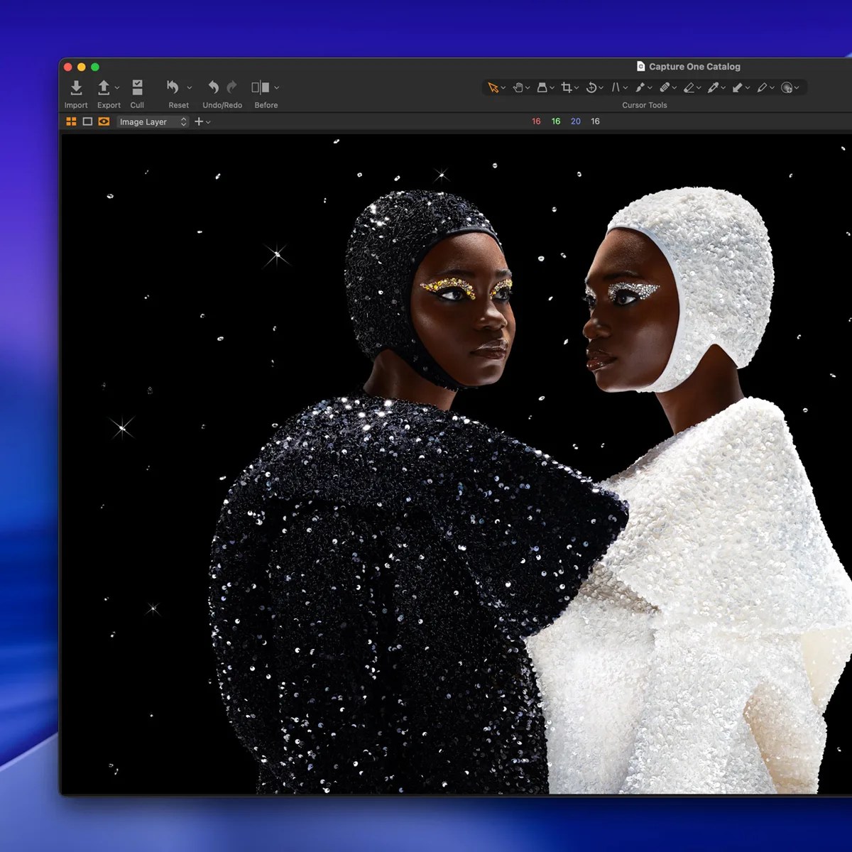 Two models wearing sequined black and white outfits with matching headpieces and glittery eye makeup against a black background.