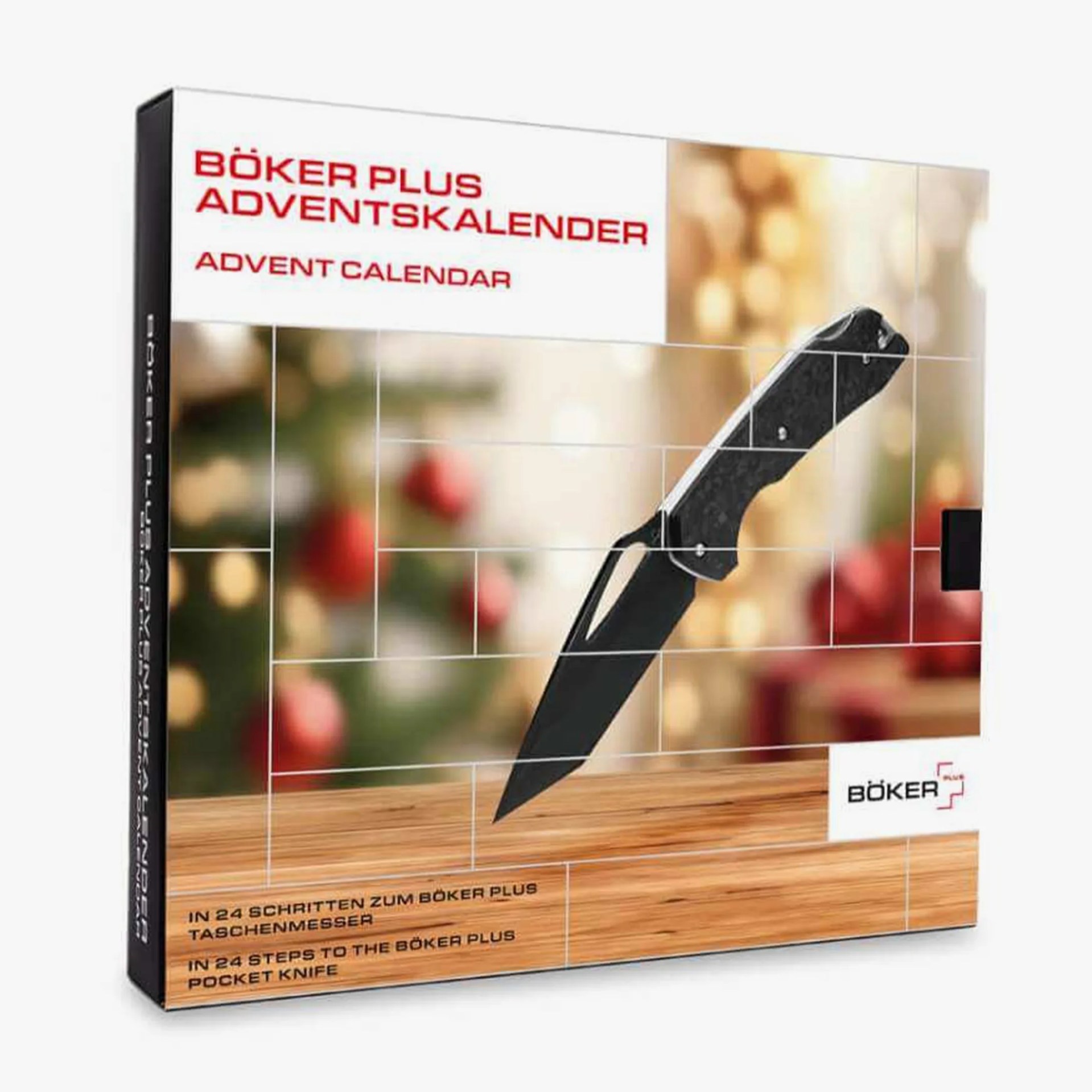 B&ouml;ker Plus Advent calendar box featuring a black pocket knife on a wooden surface with blurred holiday decorations in the background.