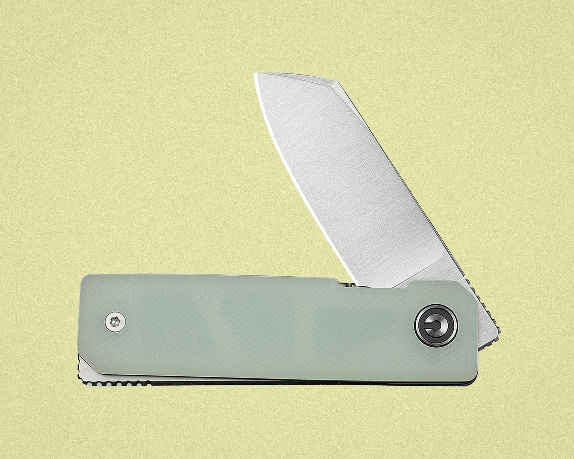 Folding knife with partially open brushed steel blade and light green textured handle on pale yellow background.