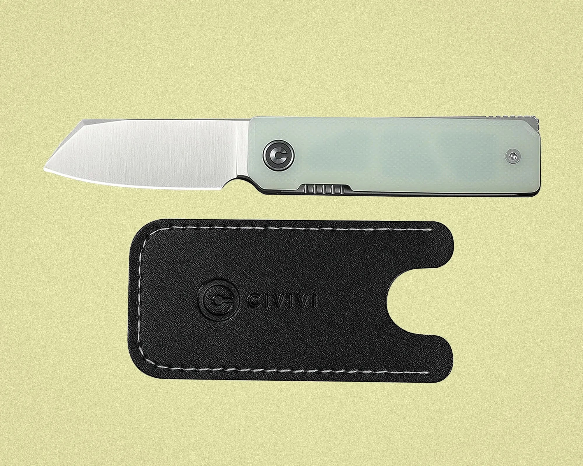 Folding knife with a silver blade and translucent pale green handle next to a black leather sheath embossed with "CIVIVI.