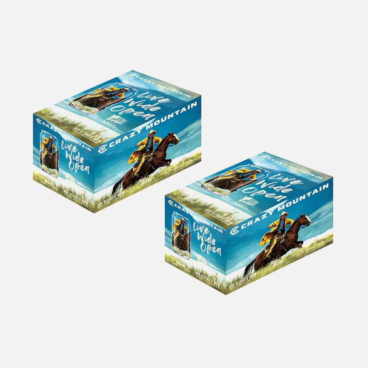 Two blue rectangular boxes of Crazy Mountain Live Wide Open non-alcoholic beer featuring a cowboy riding a horse on the packaging.