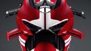 Front view of a red Ducati motorcycle with white racing stripes and aerodynamic winglets on the fairing.