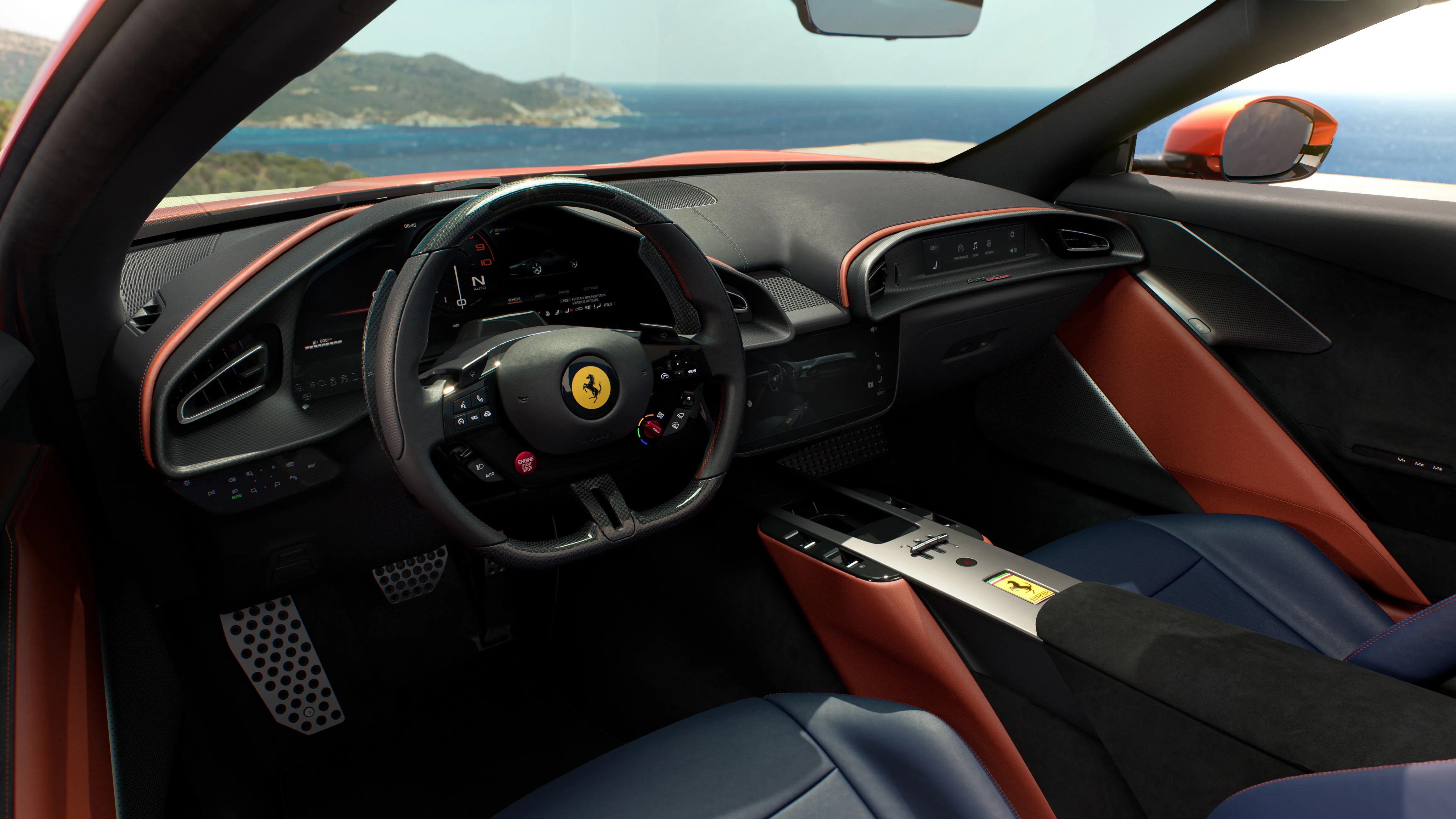 Luxury sports car interior with black and orange leather trim, carbon fiber steering wheel, and digital dashboard.
