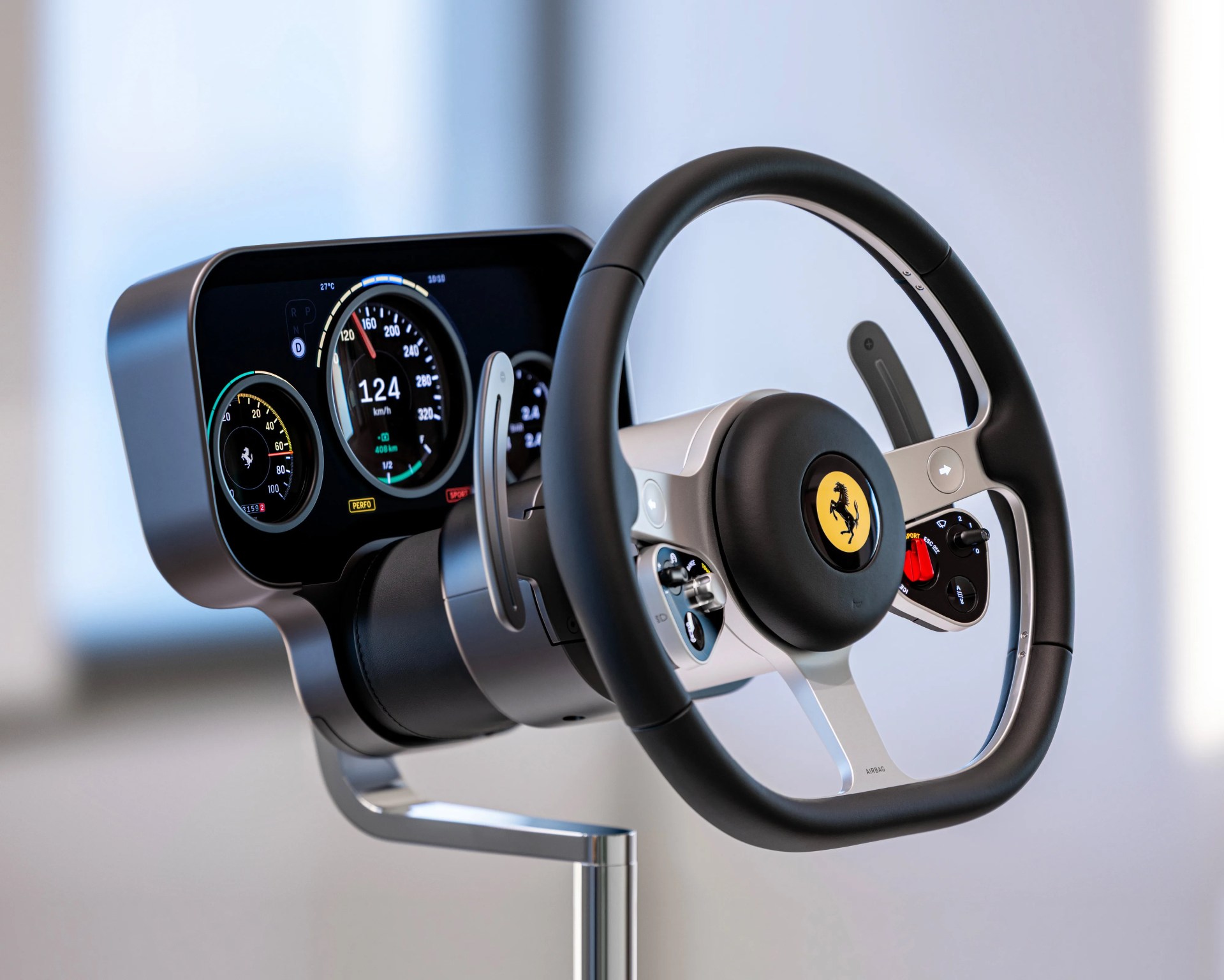 Black and silver Ferrari steering wheel with digital dashboard display mounted on a stand.