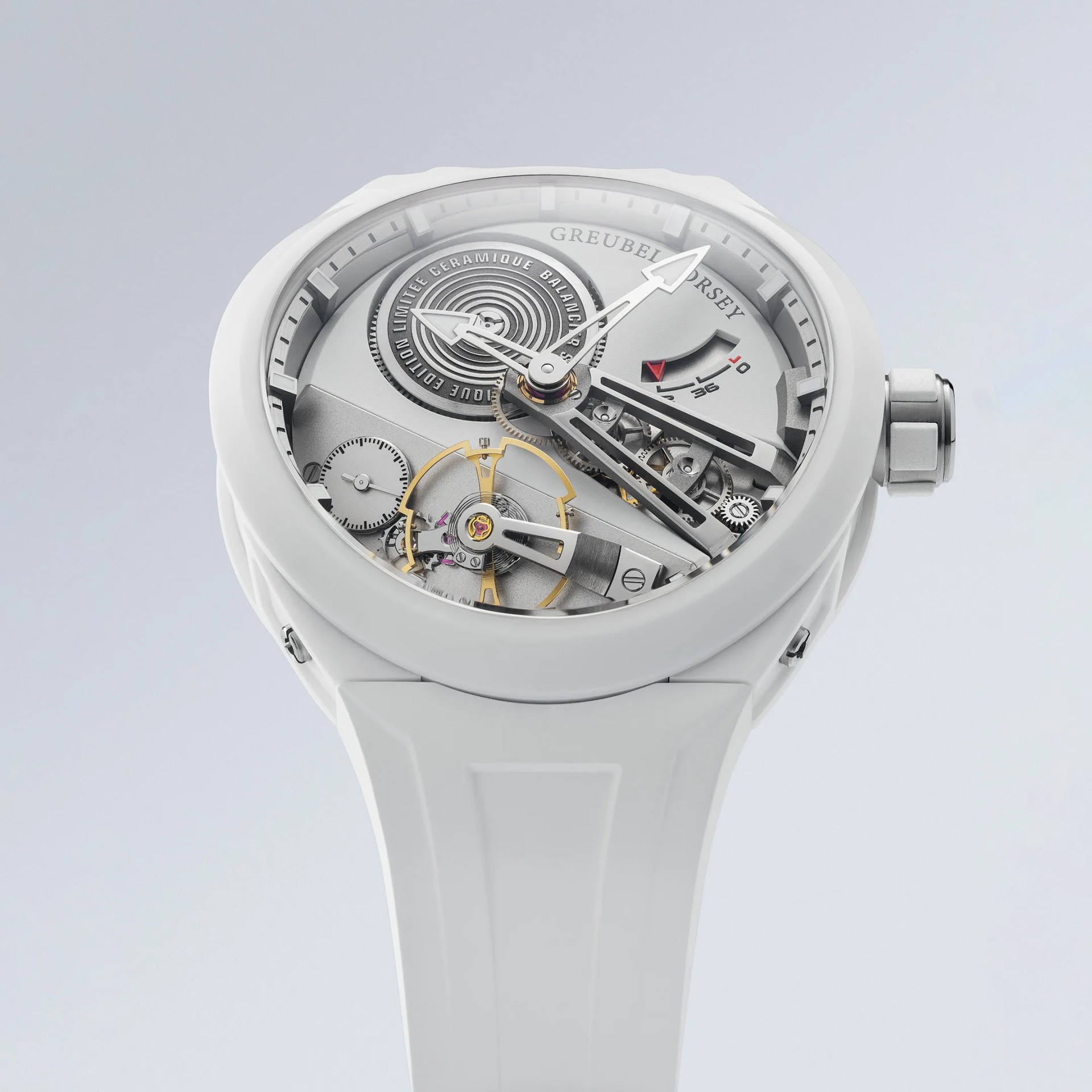 White ceramic wristwatch with exposed mechanical gears and a white rubber strap.