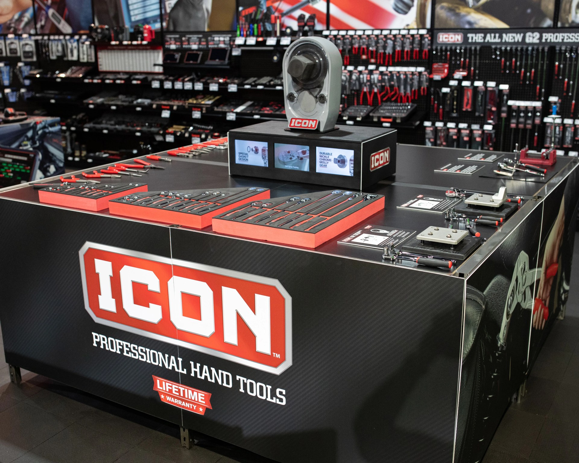 Display table with various ICON professional hand tools and tool sets in a store setting.