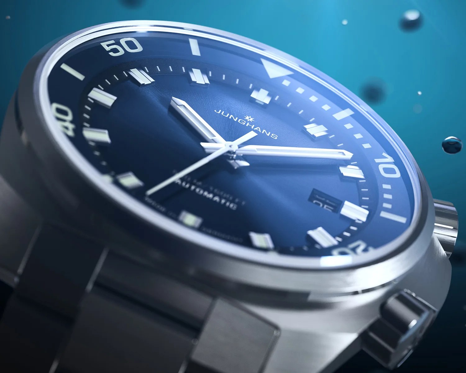 Close-up of a Junghans automatic wristwatch with a blue dial and stainless steel case and bracelet.