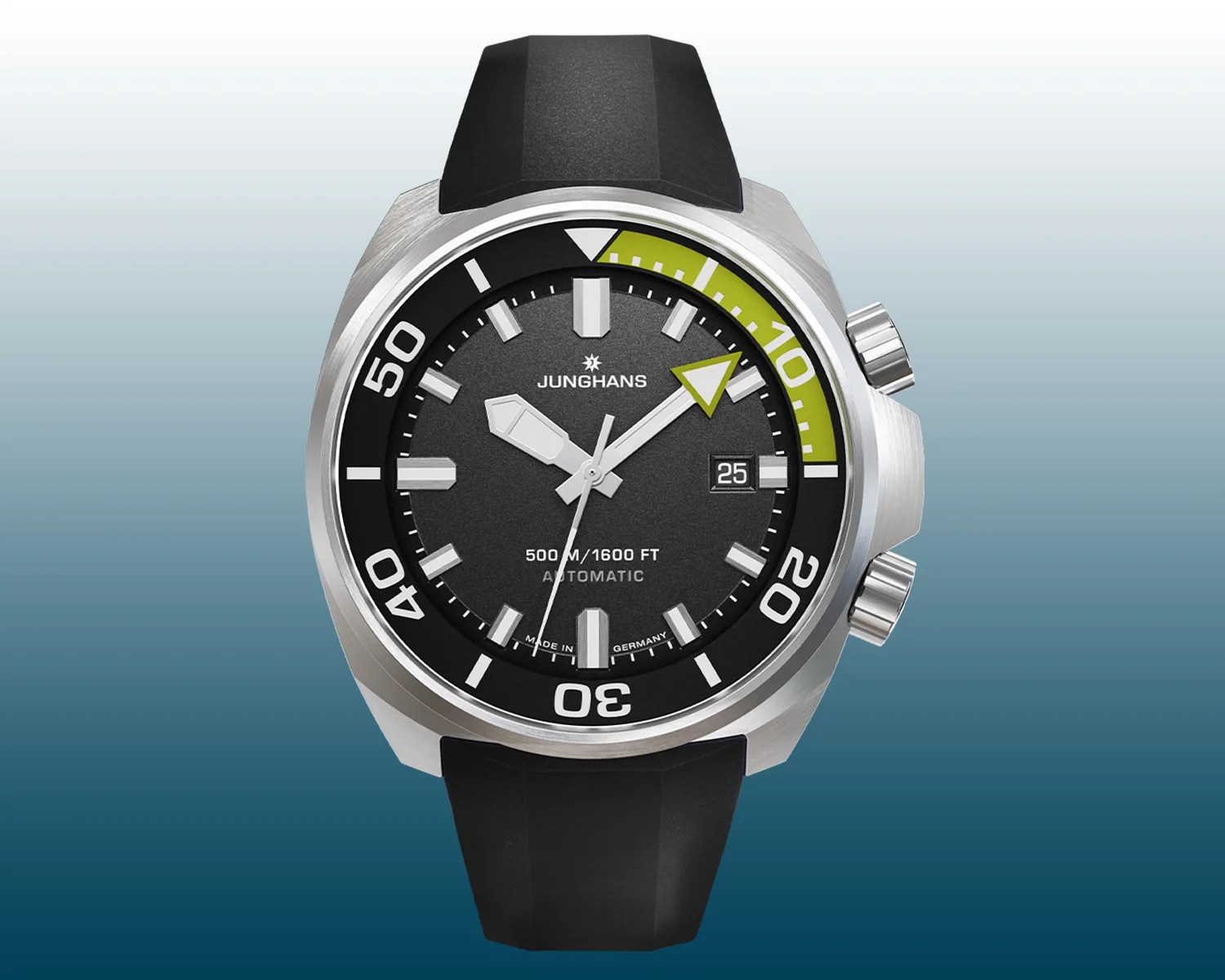 Black Junghans dive watch with silver bezel, black rubber strap, and green accent on the dial's 10-minute marker.
