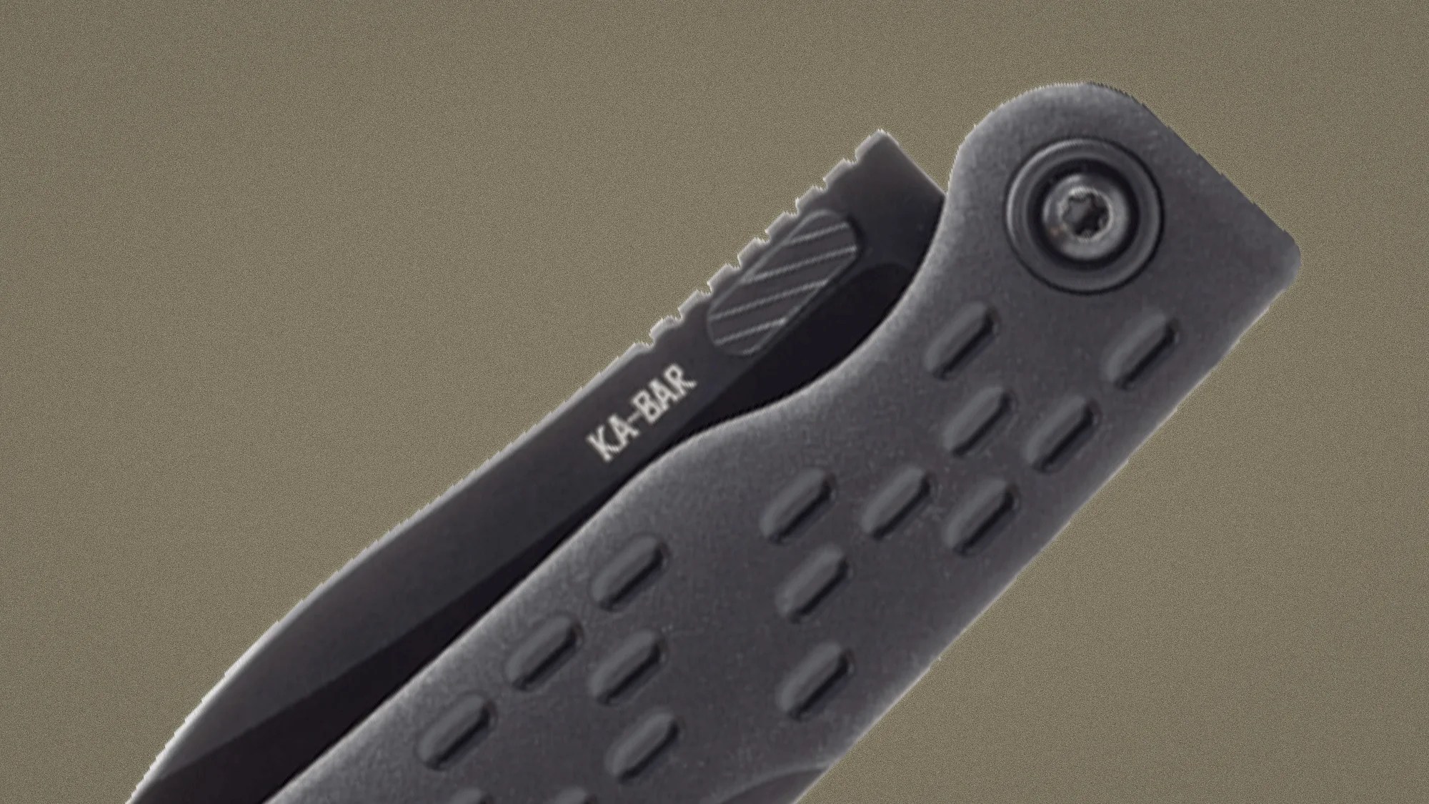 Black KA-BAR folding knife with textured grip handle and partially visible serrated blade.
