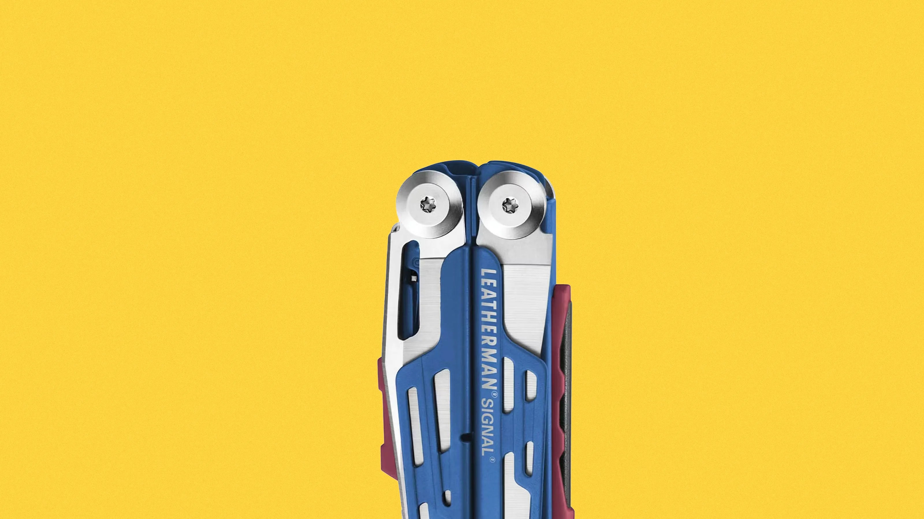 Blue and silver Leatherman Signal multi-tool with red accents against a yellow background.