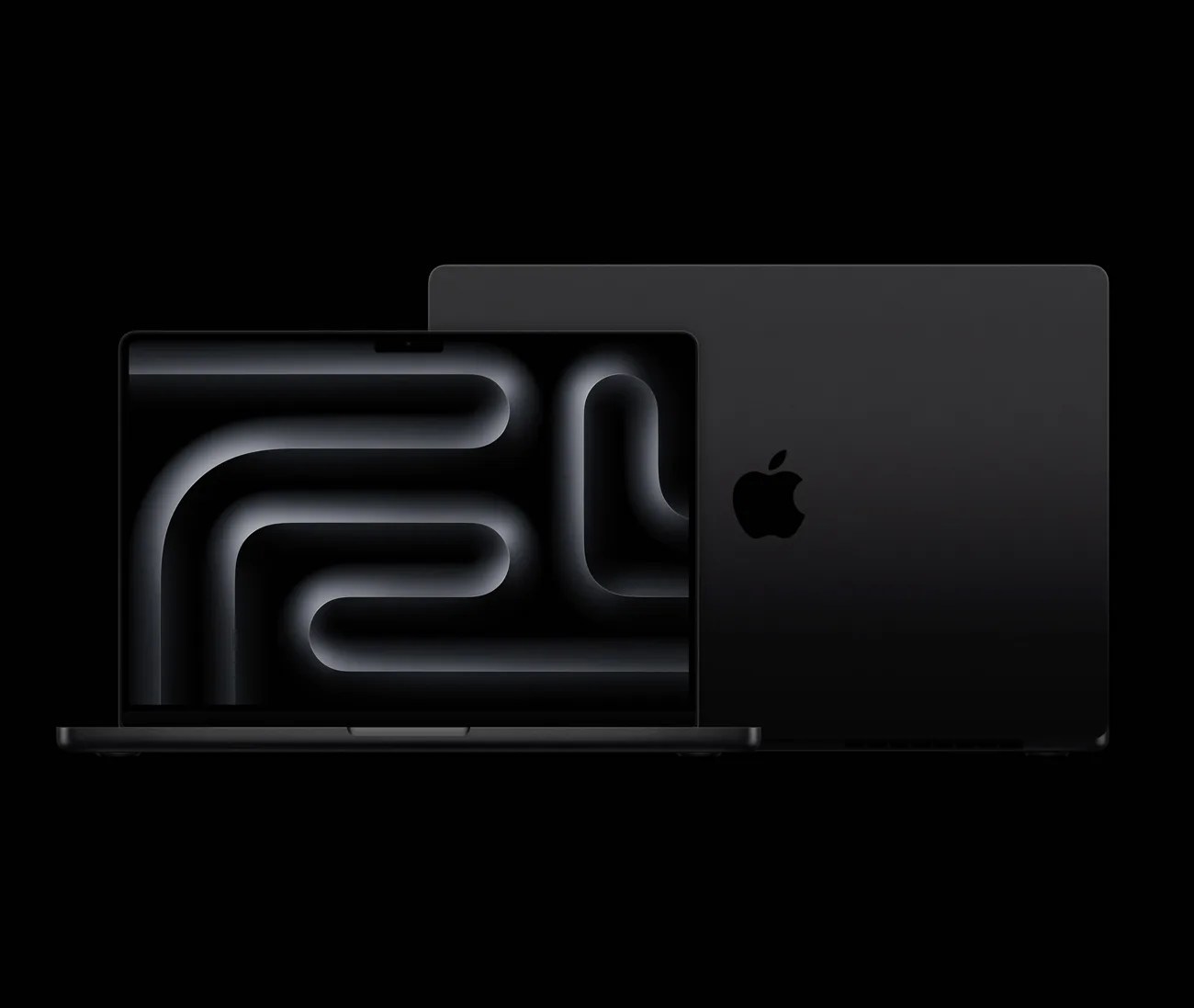 Two black Apple MacBook laptops, one open showing a dark abstract wallpaper and the other closed with the Apple logo visible.