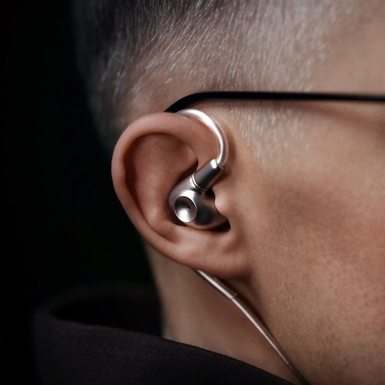 a close-up of a high-end monitor in an ear