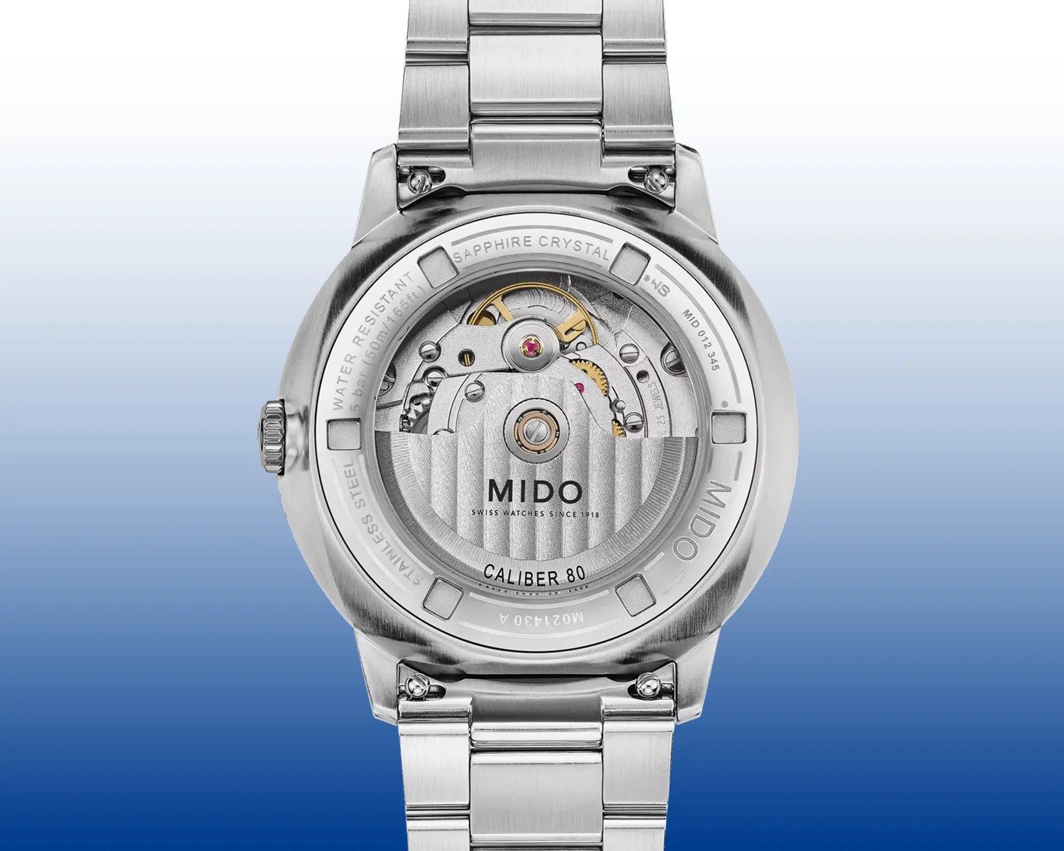 Back view of a stainless steel Mido wristwatch showing the Caliber 80 automatic movement through a sapphire crystal case back.