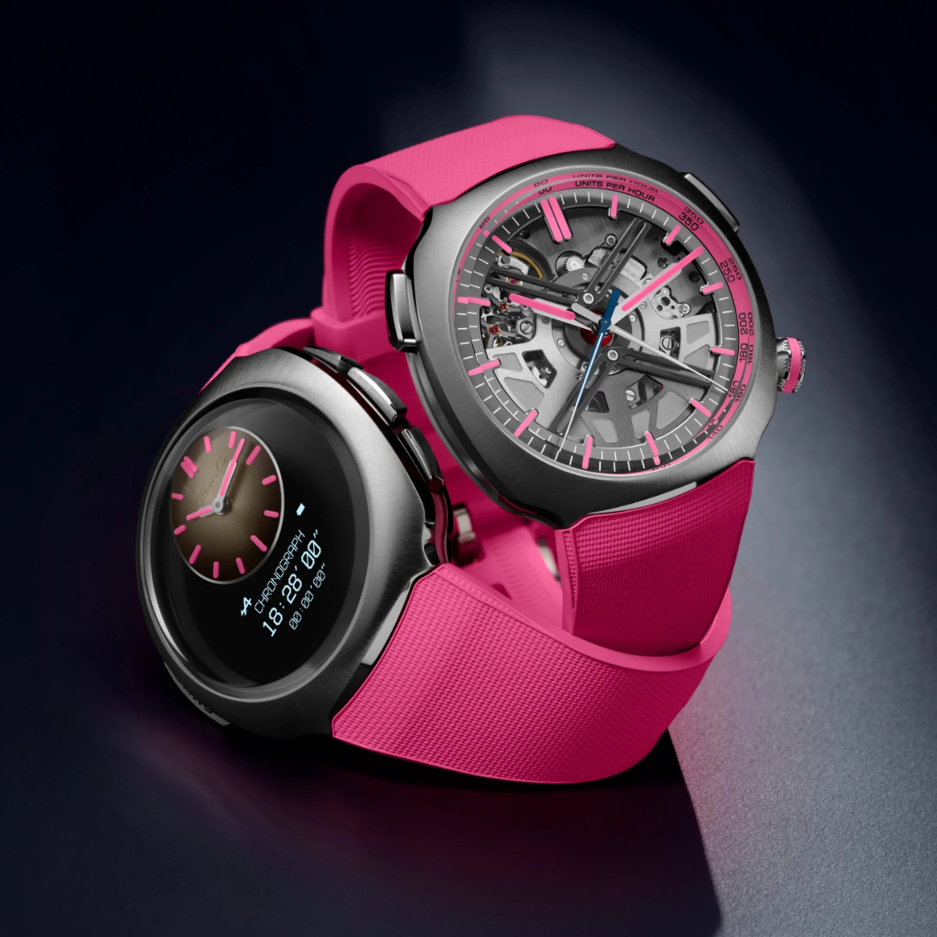 Two watches with pink silicone straps, one showing a mechanical dial and the other a digital chronograph display.