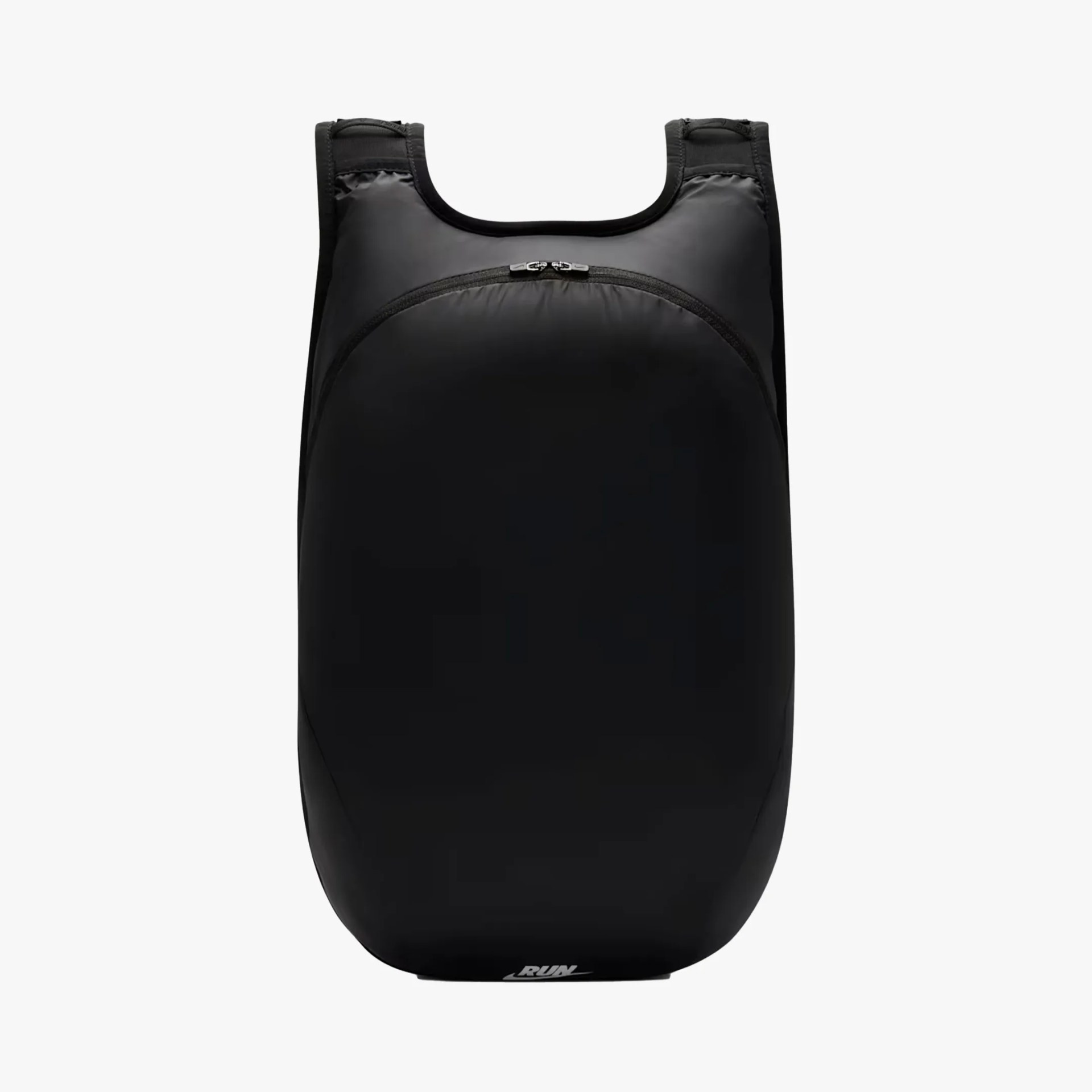Black minimalist backpack with rounded shape and top zipper pocket.