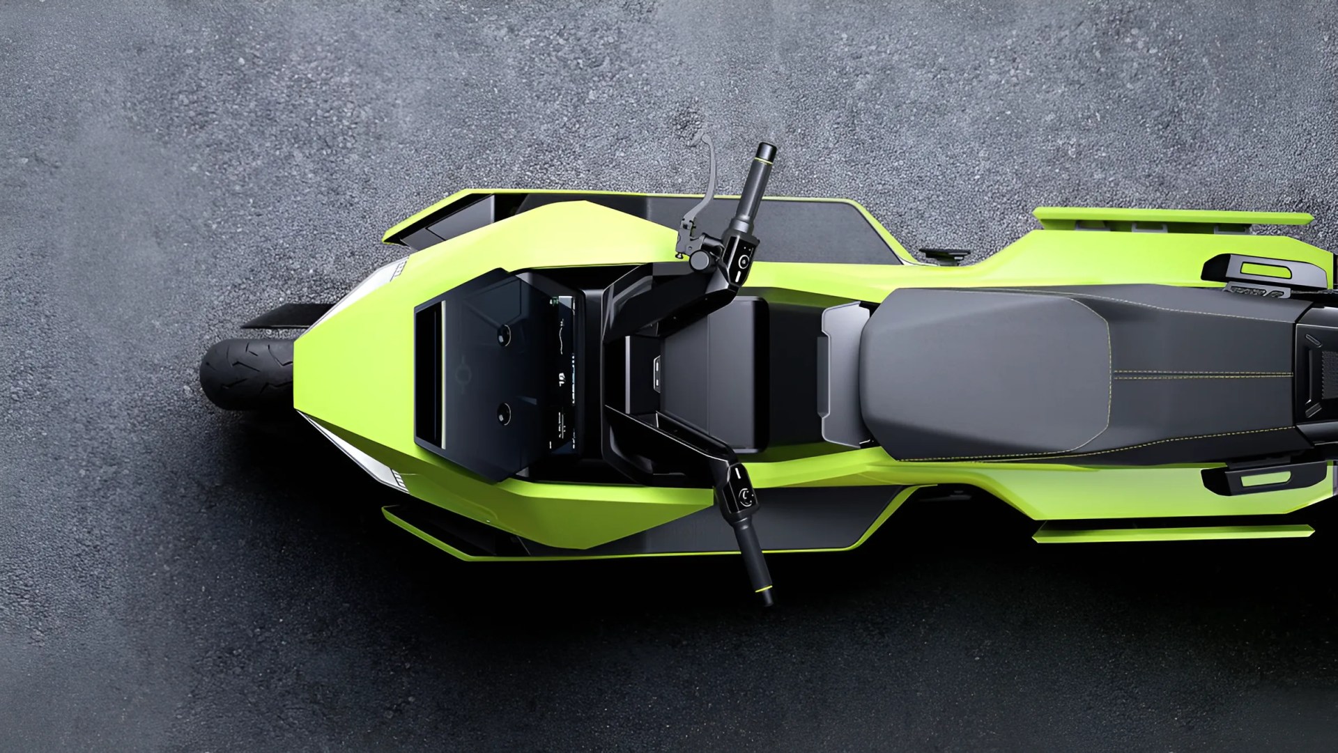 Top view of a lime green and black electric motorcycle with a digital display and black seat on asphalt.