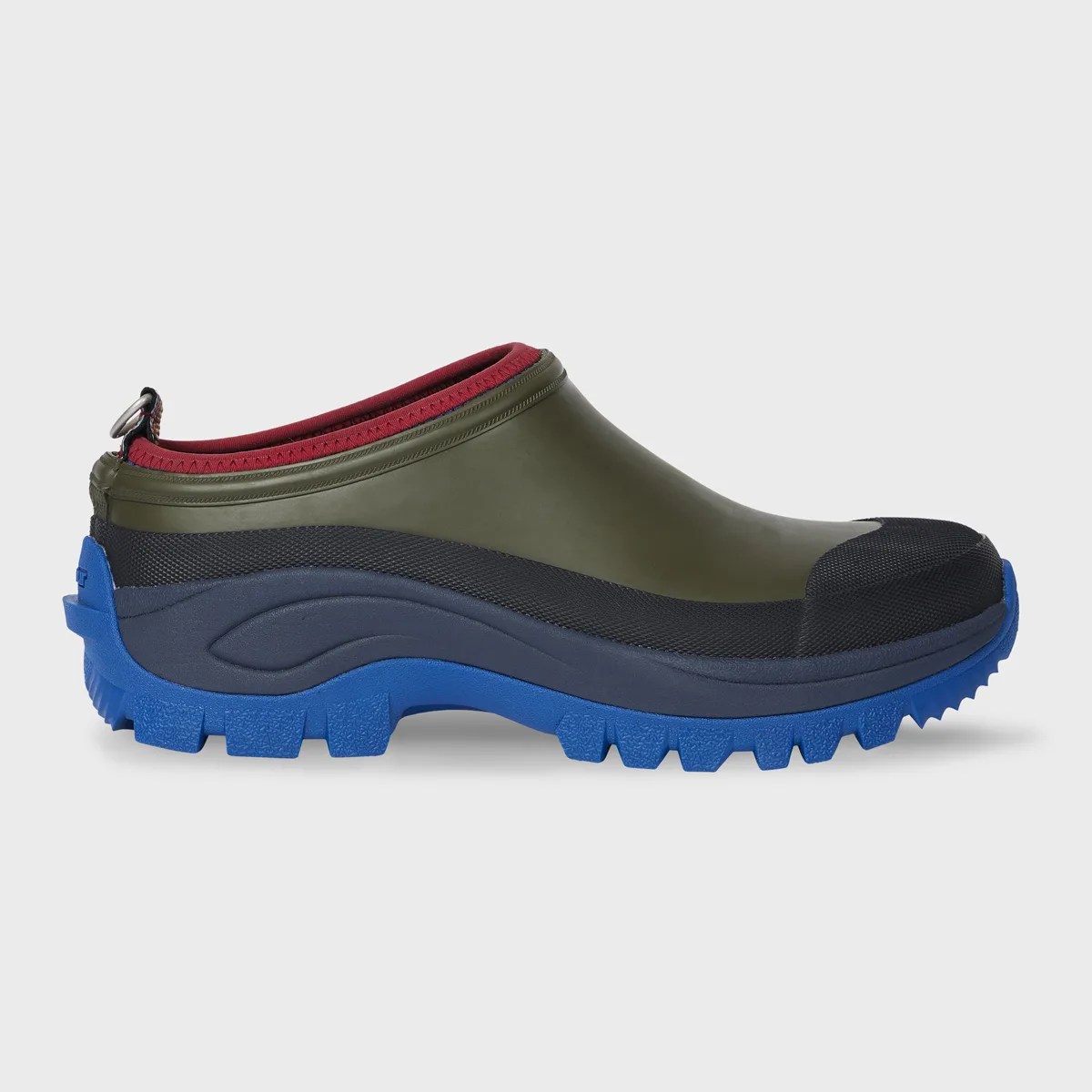 Olive green slip-on shoe with black and navy upper and bright blue rugged sole.