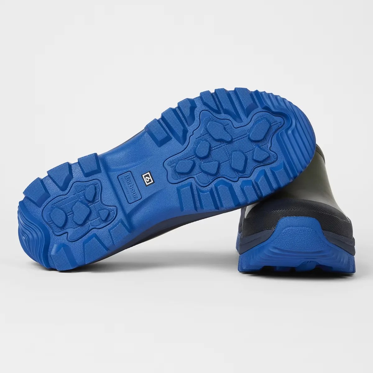 Pair of black boots with bright blue rugged soles, one boot showing the sole with Barbour branding and size 6 label.