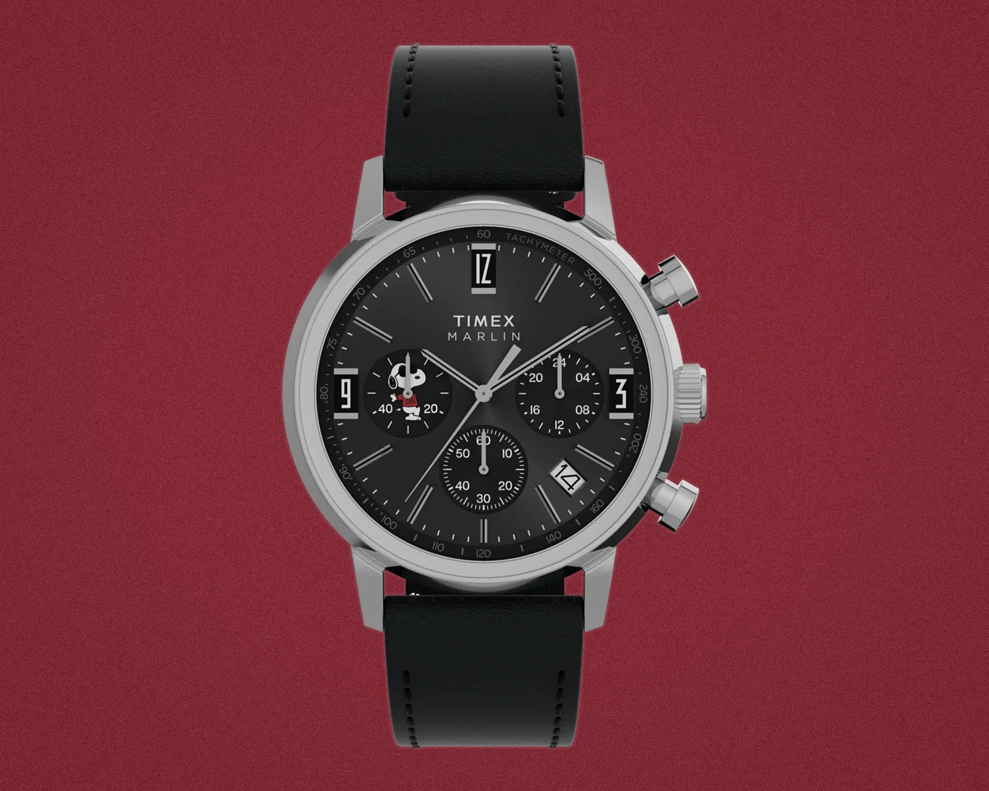 Black Timex Marlin chronograph watch with silver case, black leather strap, and Snoopy character on subdial.