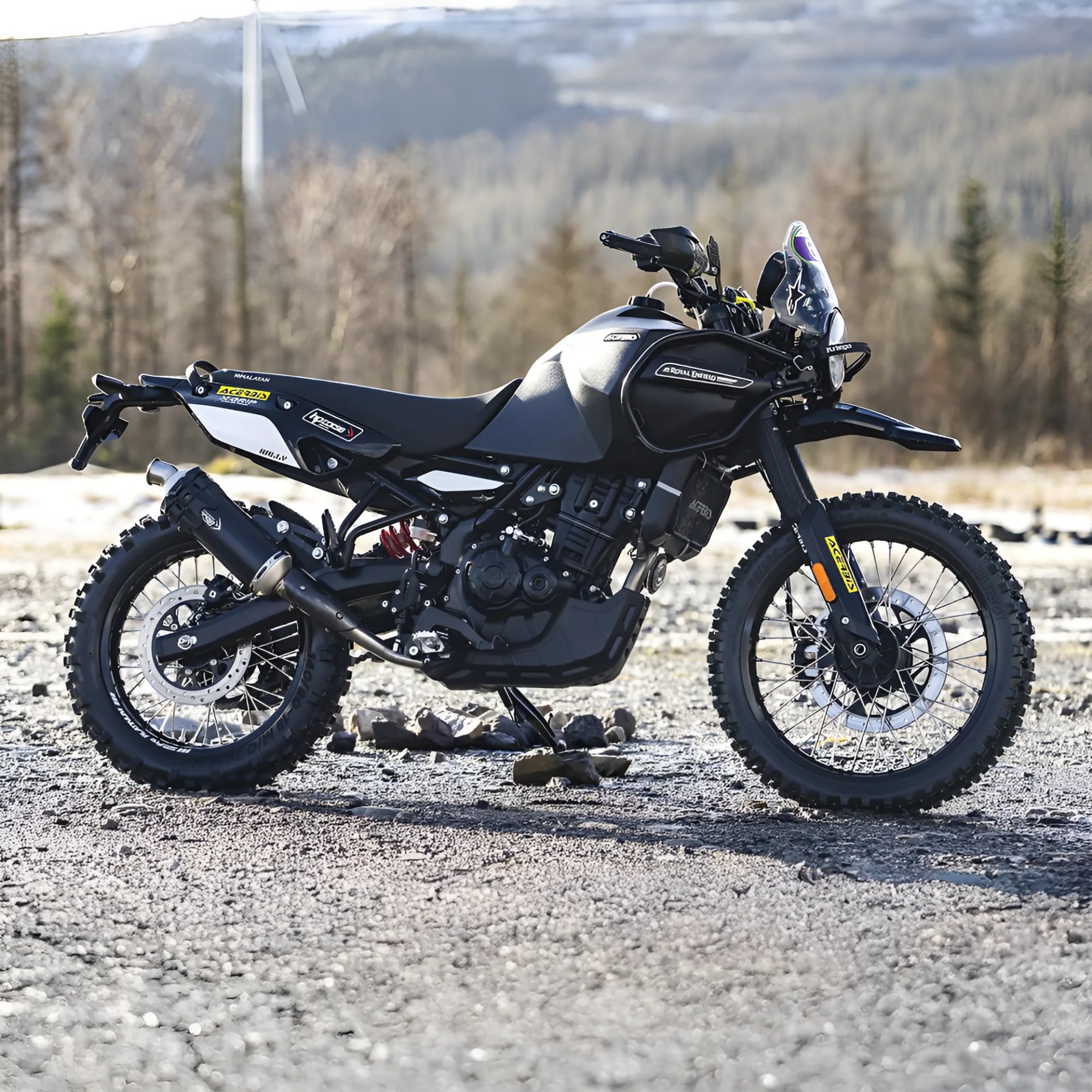 Black Royal Enfield Himalayan adventure motorcycle with knobby tires parked on rocky ground.