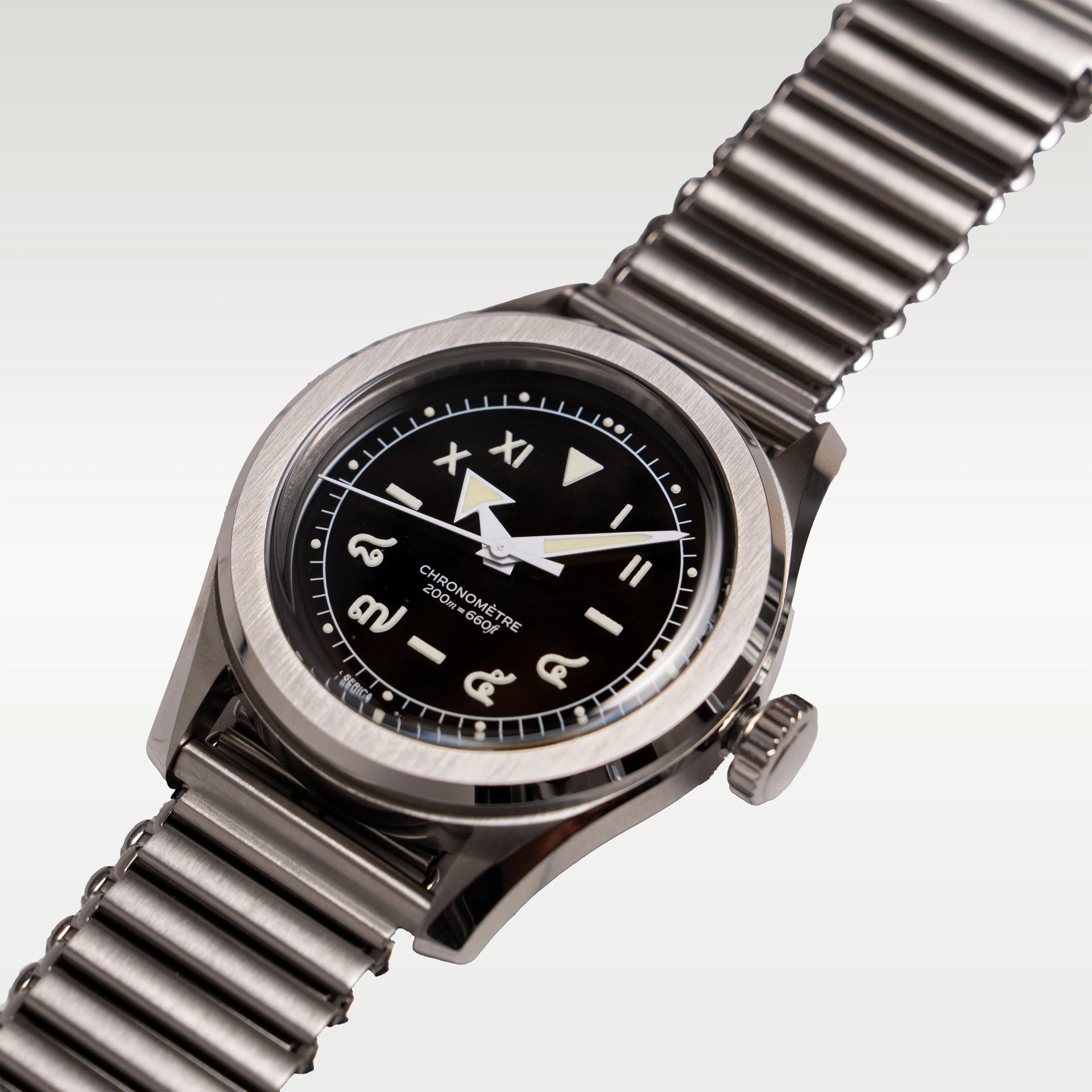 Stainless steel wristwatch with black dial featuring mixed Roman and Thai numerals and luminous hands.