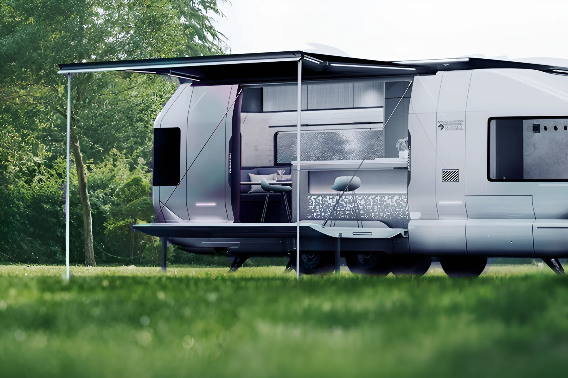 Futuristic white camper trailer with an extended awning and modern interior seating and kitchen area visible.