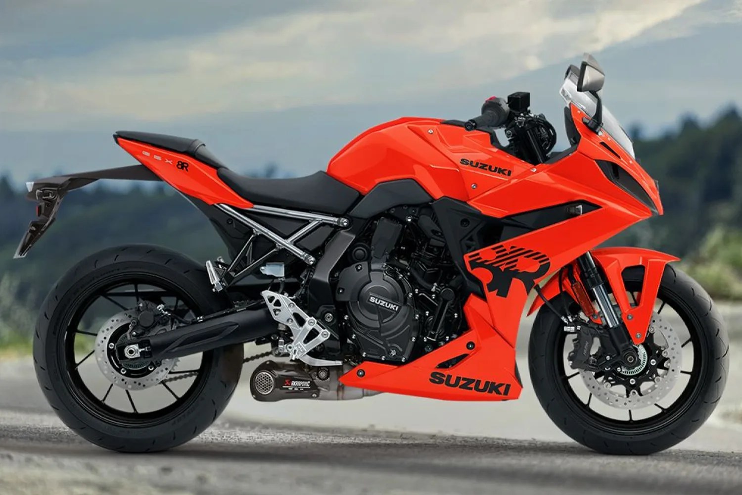 Bright orange Suzuki sport motorcycle with black accents and aerodynamic fairing parked on a road.