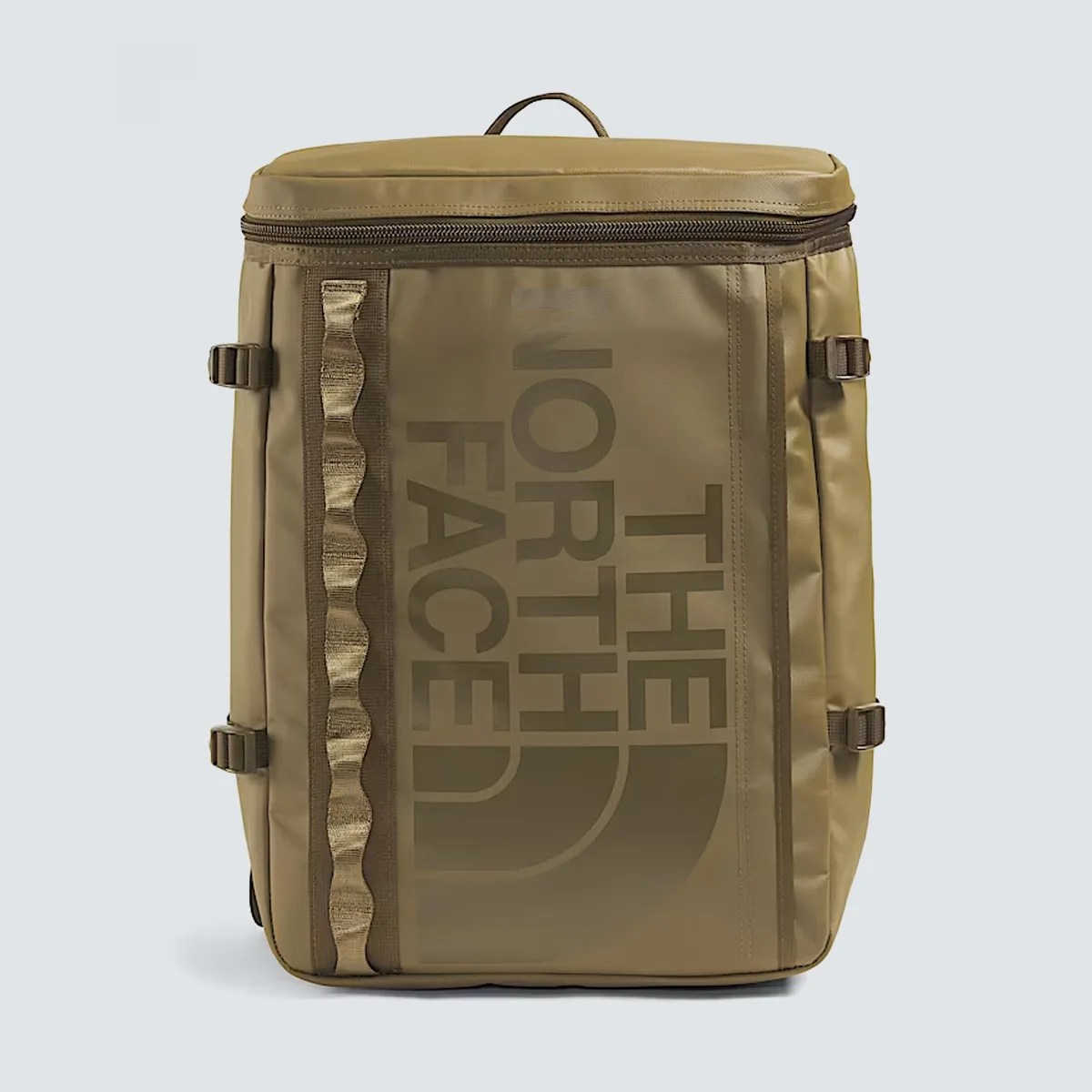 Square-shaped olive green backpack with vertical "The North Face" logo and side compression straps.