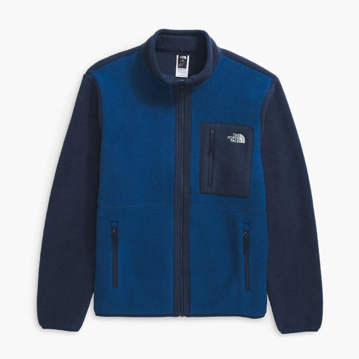 Blue and navy fleece jacket with full front zipper and zippered chest and side pockets.